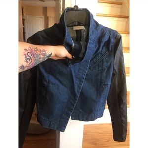 Beautiful jean jacket with faux leather sleeves.
